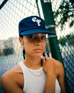 The Grandad Hat represents a unique shape, made with quality fabrics from durable cotton twill. Minimalist and timeless, the Grandad Hat is your go-to accessory for laid-back style. With a subtle embroidered EF logo, this cap adds polish to any outfit and brings a modern day approach to an unmatched era of style, the 90s.
Vintage visor with the green under brim for the connoisseur .Unisex 90s style EF streetwear snapback cap, navy grandad cotton hat with embroidery and green underbrim.