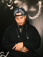 The OG Cap is a pure legacy from the 90s.

Crafted in iconic black and silver and a bold gothic font Extnded Family at the back, the OG collection is more than just a hat - a deeply cultural artifact tied to identity, rebellion, and street style.
This vintage style classic snapback, flat brim, adjustable snap closure and green underbrim is made for those who stands for something.
