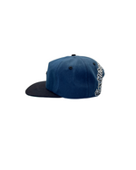 The OG Cap is a pure legacy from the 90s.

Crafted in iconic black and silver and a bold gothic font Extnded Family at the back, the OG collection is more than just a hat - a deeply cultural artifact tied to identity, rebellion, and street style.
This vintage style classic snapback, flat brim, adjustable snap closure and green underbrim is made for those who stands for something.