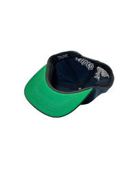 The OG Cap is a pure legacy from the 90s.

Crafted in iconic black and silver and a bold gothic font Extnded Family at the back, the OG collection is more than just a hat - a deeply cultural artifact tied to identity, rebellion, and street style.
This vintage style classic snapback, flat brim, adjustable snap closure and green underbrim is made for those who stands for something.
