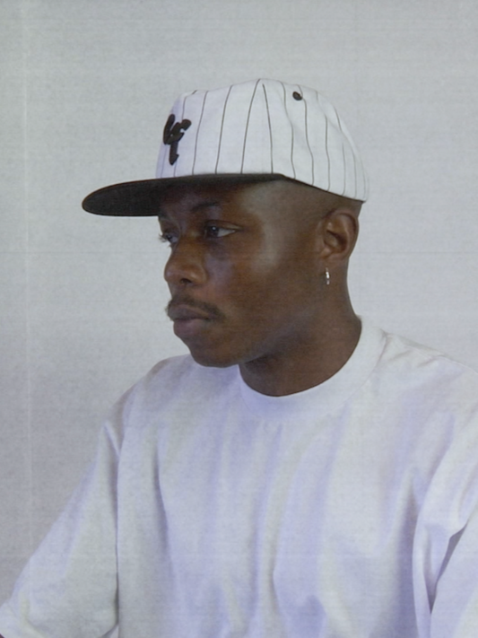 The Sports Hat represents a true staple of the 90s! This vintage athletic style classic snapback with a bold pinstripe design and unstructured silhouette is for those who put it in the work day in, day out.
Grind now, play later, and cop this 90s gem, the perfect throwback essential for streetwear lovers and active lifestyles.
90s Snapback hat with black stripe, black visor and white profile and EF logo. Vintage style snapback.