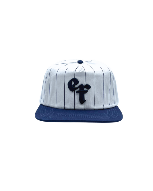The Sports Hat represents a true staple of the 90s! This vintage athletic style classic snapback with a bold pinstripe design and unstructured silhouette is for those who put it in the work day in, day out.
Grind now, play later, and cop this 90s gem, the perfect throwback essential for streetwear lovers and active lifestyles.
90s Snapback hat with navy stripe, navy visor and white profile and EF logo. Vintage style snapback.