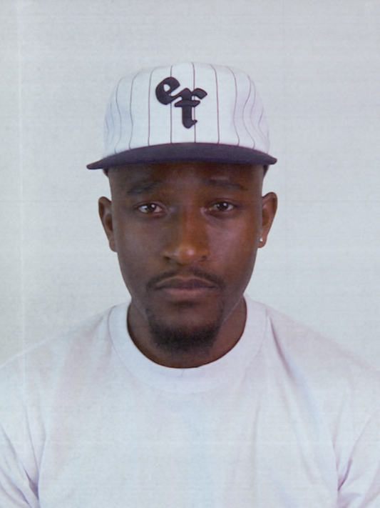 The Sports Hat represents a true staple of the 90s! This vintage athletic style classic snapback with a bold pinstripe design and unstructured silhouette is for those who put it in the work day in, day out.
Grind now, play later, and cop this 90s gem, the perfect throwback essential for streetwear lovers and active lifestyles.
90s Snapback hat with navy stripe, navy visor and white profile and EF logo. Vintage style snapback.