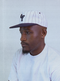 The Sports Hat represents a true staple of the 90s! This vintage athletic style classic snapback with a bold pinstripe design and unstructured silhouette is for those who put it in the work day in, day out.
Grind now, play later, and cop this 90s gem, the perfect throwback essential for streetwear lovers and active lifestyles.
90s Snapback hat with navy stripe, navy visor and white profile and EF logo. Vintage style snapback.
